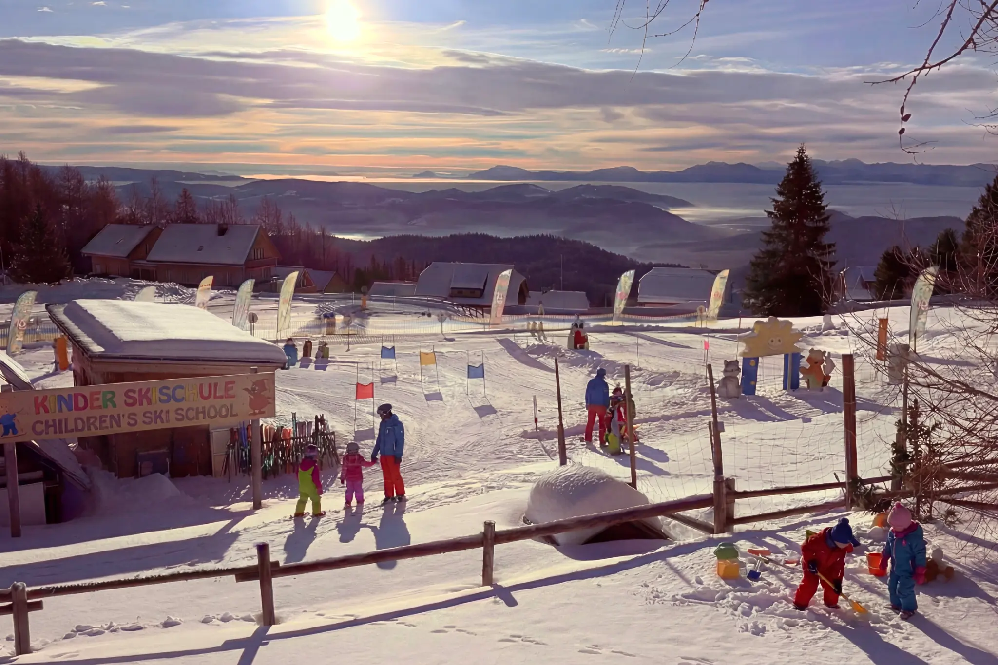 Children's ski area and ski school at Hochrindl with a view across Carinthia